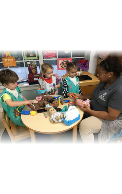 smiling little kids with a teacher