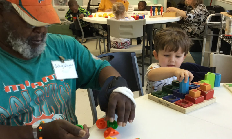 an adult and a child playing