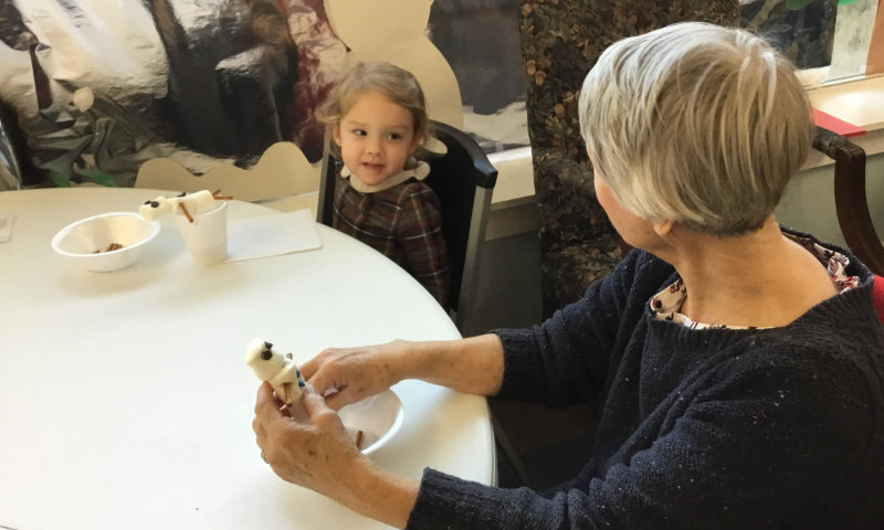 an adult and a child talking